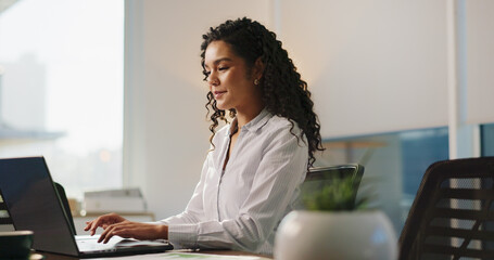 Business, laptop and woman in office, connection and email for audit results, typing and financial...