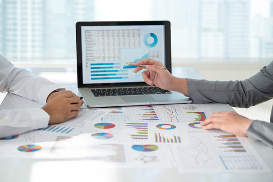 Business financial team meeting working and present report data charts and graphs and analysis business statistic for financial planning management.