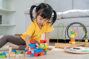 Happy Asia children play and learn toy blocks.family is happy and excited in the house. daughter...