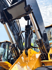 Heavy machinery in operation at a construction site during the day showcasing hydraulic systems and...