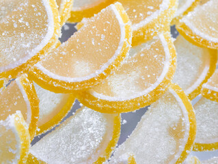 Sweet and tangy citrus slices dusted with sugar sparkle under soft lighting