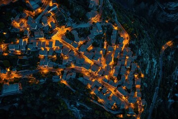 Aerial view of Saint Paul de Vence illuminated at evening twilight, Aerial of Saint-Paul-de-Vence in the evening
