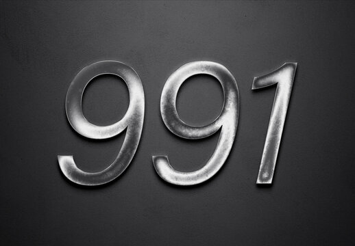 Chrome metal 3D number design of 991 on grey background.