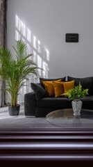 Modern living room with black sofa and mustard cushions