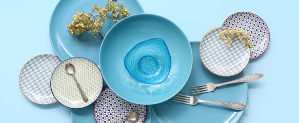 Beautiful table setting on blue background