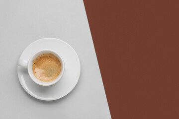 Cup of hot espresso on color background