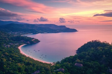 Fototapeta premium Stunning aerial view of Phuket island sunset illuminating the bay and lush greenery, Thailand tourist boat at sunset Phuket island coast aerial landscape