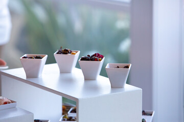 Catering service offering small portions of food during an event