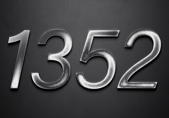 Chrome metal 3D number design of 1352 on grey background.