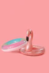 Inflatable rings on pink background