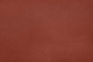 Fototapeta premium Detailed view of a terracotta fabric, showcasing its fine texture and making a great background.
