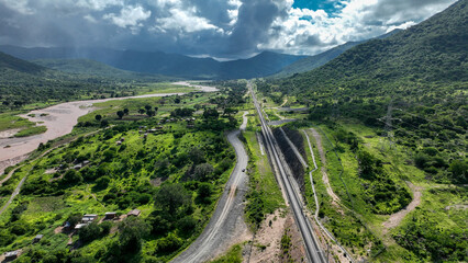 Railway Stretching Through Lush Dense Forest