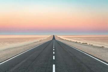 Naklejka premium Endless desert highway at sunset