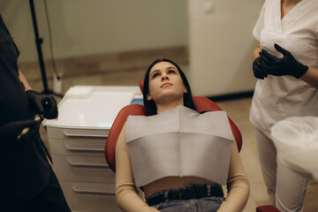 Patient in Dental Clinic During Consultation With Medical Professionals