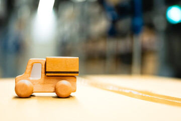 Miniature package box placed on a model car in a warehouse, concept of online shopping and delivery.	