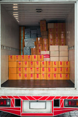 Container vans loaded with parcels ready for transport to various locations. A concept for a growing delivery business following the online shopping business.