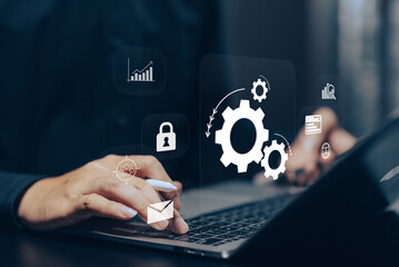 Business Process Automation: Hands using a stylus on a tablet, interacting with virtual gears, lock, chart, and other process icons, symbolizing workflow efficiency and technological solutions.