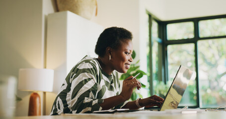 Fototapeta na wymiar Budgeting, black woman and laptop with reading in home for account review, taxes and bookkeeping. Happy, person and technology in apartment for financial planning, asset management and finance rebate