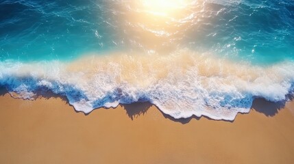 Fototapeta premium Vibrant aerial view of a sandy beach with turquoise ocean waves crashing onto shoreline under bright sunlight