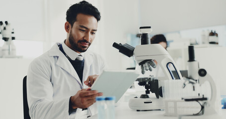 Science, research and man with tablet, internet and innovation with chemistry experiment. Medical,...