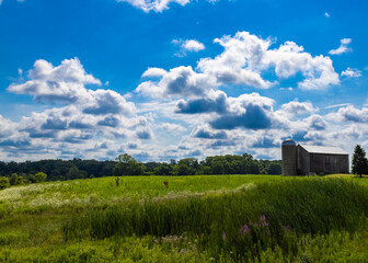 rural landscape and barn with blue sky