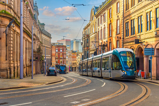 Tram in downtown Nottingham city, cityscape of England at twilight