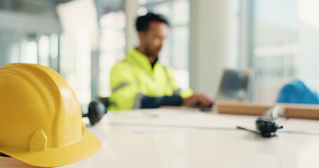 Construction, helmet and man with equipment on table for site inspection, quality control or...
