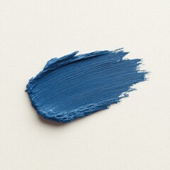 Fototapeta premium Vibrant Blue Acrylic Paint Stroke on Cream Canvas Background