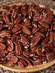 raw organic pecan nuts pattern background.