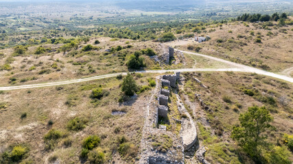 Aerial View of Ancient Ruins of Asseria, Croatia on Grassy Hillside