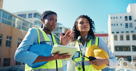Women, architecture team and discussion with tablet on construction site, inspection or maintenance. Radio, communication and city planning with task delegation, civil engineering and collaboration