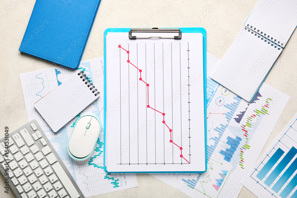 Poster notebooks with keyboard, computer mouse, many business graphics and diagrams on white background