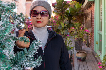 happy young woman with christmas tree