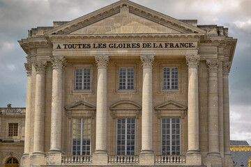 Palace Facade with Columns and Windows at Versailles Gardens, Paris.