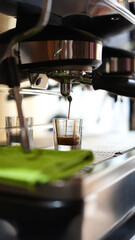 Professional Espresso Maker Pouring Fresh Coffee - Side View