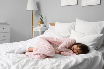 Morning of beautiful young woman sleeping in bedroom