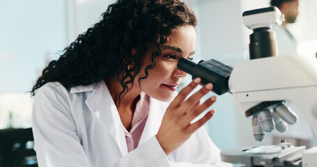 Microscope, woman and scientist in laboratory for medical research, study or analysis for...