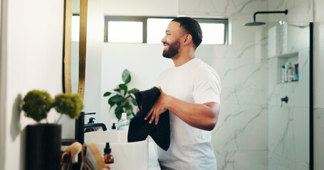 Mirror, beauty and towel with man in bathroom for skincare, grooming and cosmetics. Morning...