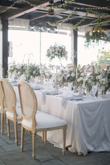 lovely Table setting for magnificent composition from flowers at a wedding