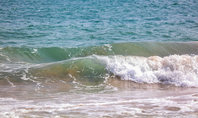 The ocean is calm and the water is a beautiful shade of blue
