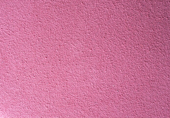 Pink textured surface with rough grain, ideal as a background for creative projects, posters,...