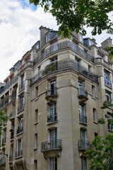 Apartment Building Exterior with Balconies and Stone Facade