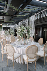 lovely Table setting for magnificent composition from flowers at a wedding