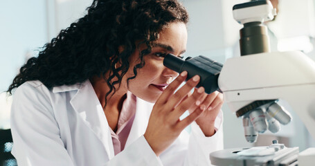 Microscope, woman and scientist in laboratory for research, study or analysis for medical...