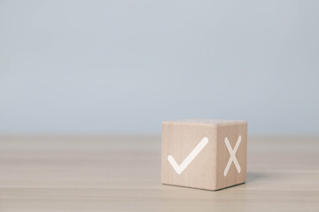 The wood block shows the right and wrong choices to make a decision and select yes or no. Concept...