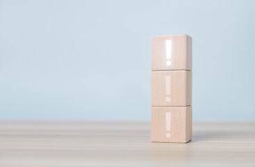 The wood block shows an important point icon, a hazard symbol, and an error sign. Concept of...