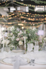 lovely Table setting for magnificent composition from flowers at a wedding , Centerpiece white and orange color palette flower bouquet arrangement