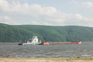 Bulk cargo ship on the Volga River in summer, Russia