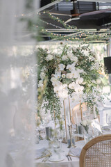 lovely Table setting for magnificent composition from flowers at a wedding , Centerpiece white and orange color palette flower bouquet arrangement