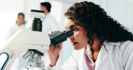 Microscope, woman and scientist in laboratory for study, research or analysis for medical...